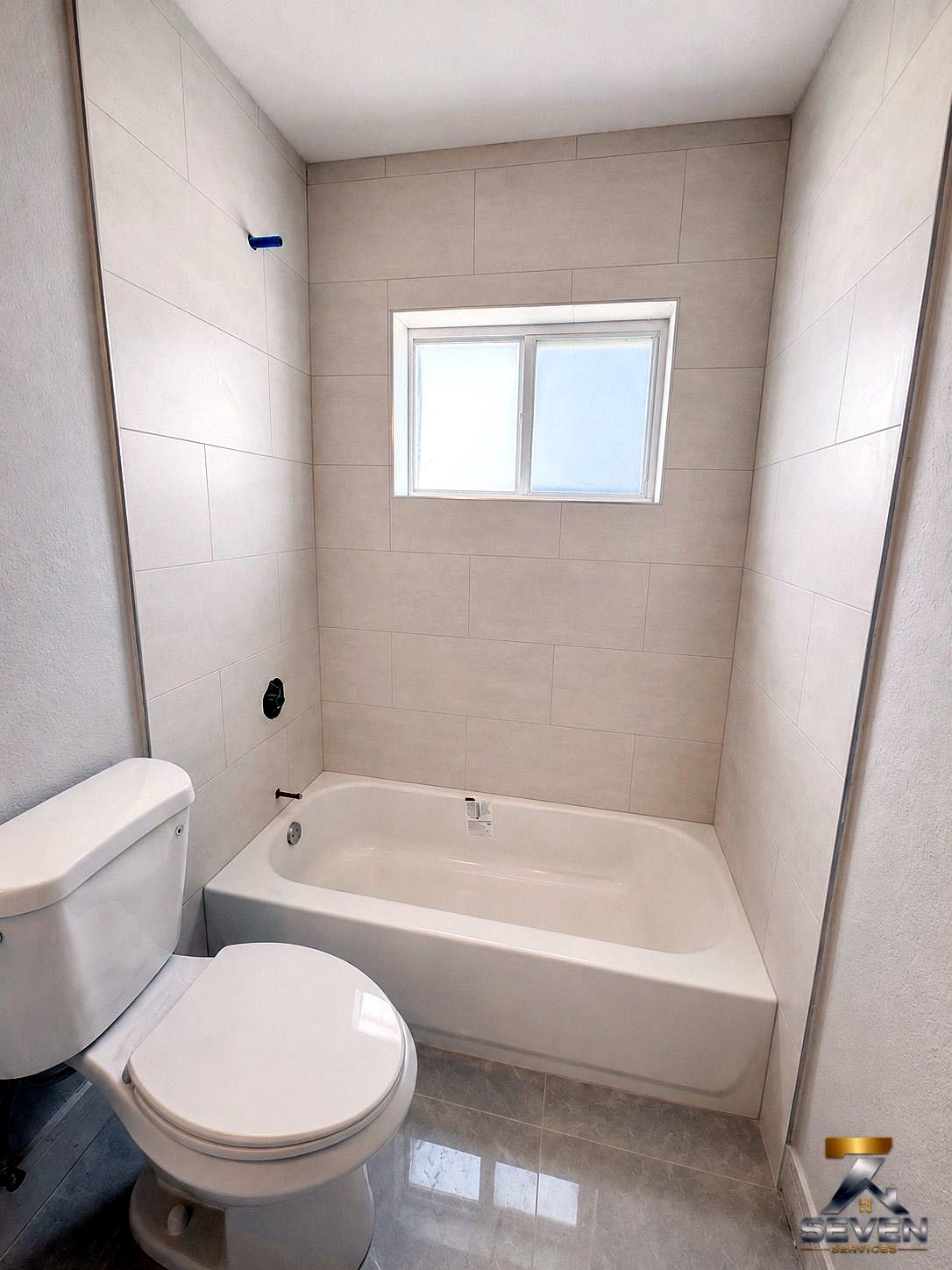 Bathroom remodeling and tile installation project by Seven Services